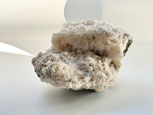 Calcite with pyrite, quartz, and galena (or tetrahedrite)