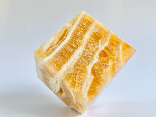 Orange Calcite Floating cube, ~19 oz