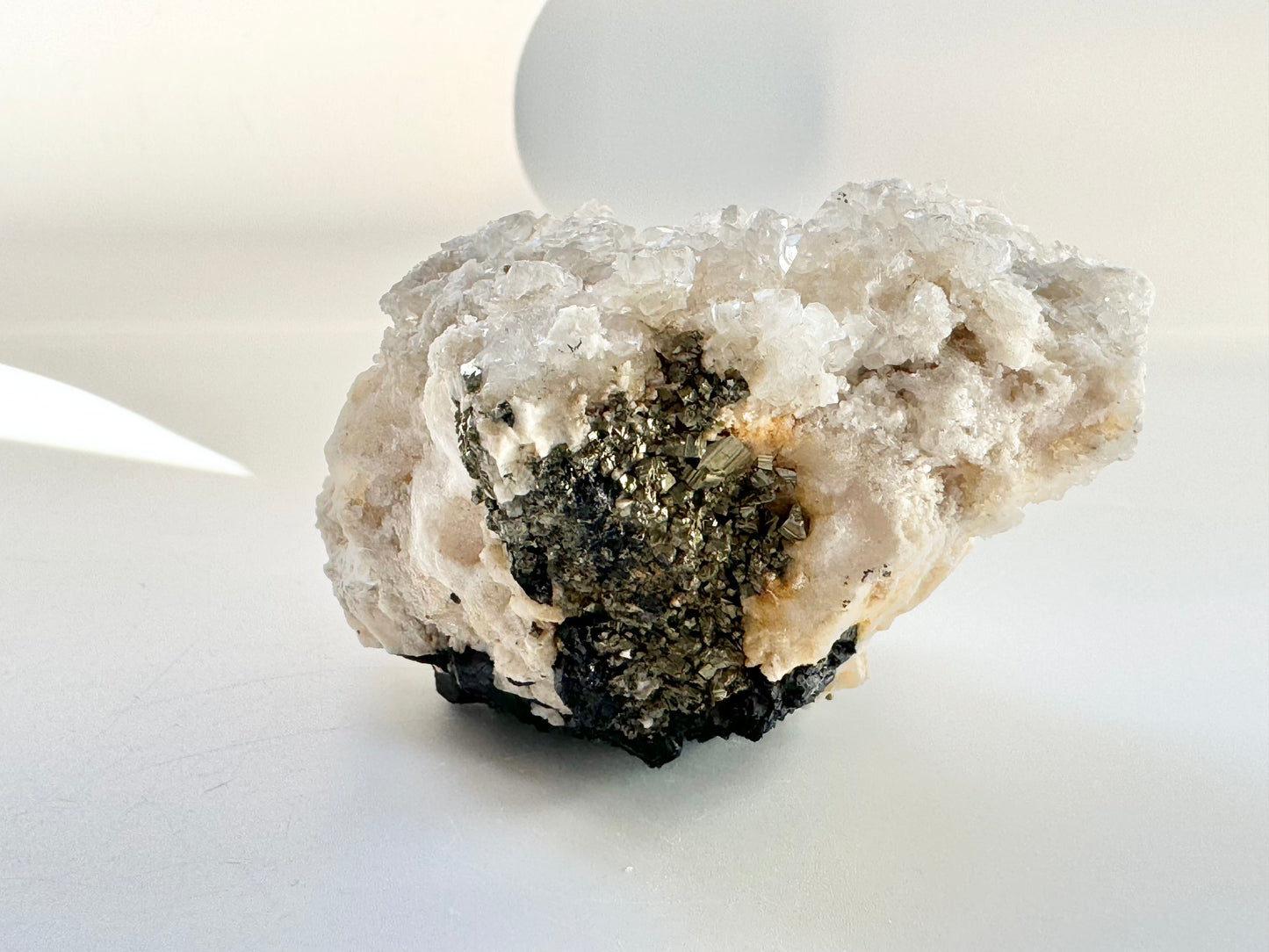 Calcite with pyrite, quartz, and galena (or tetrahedrite)