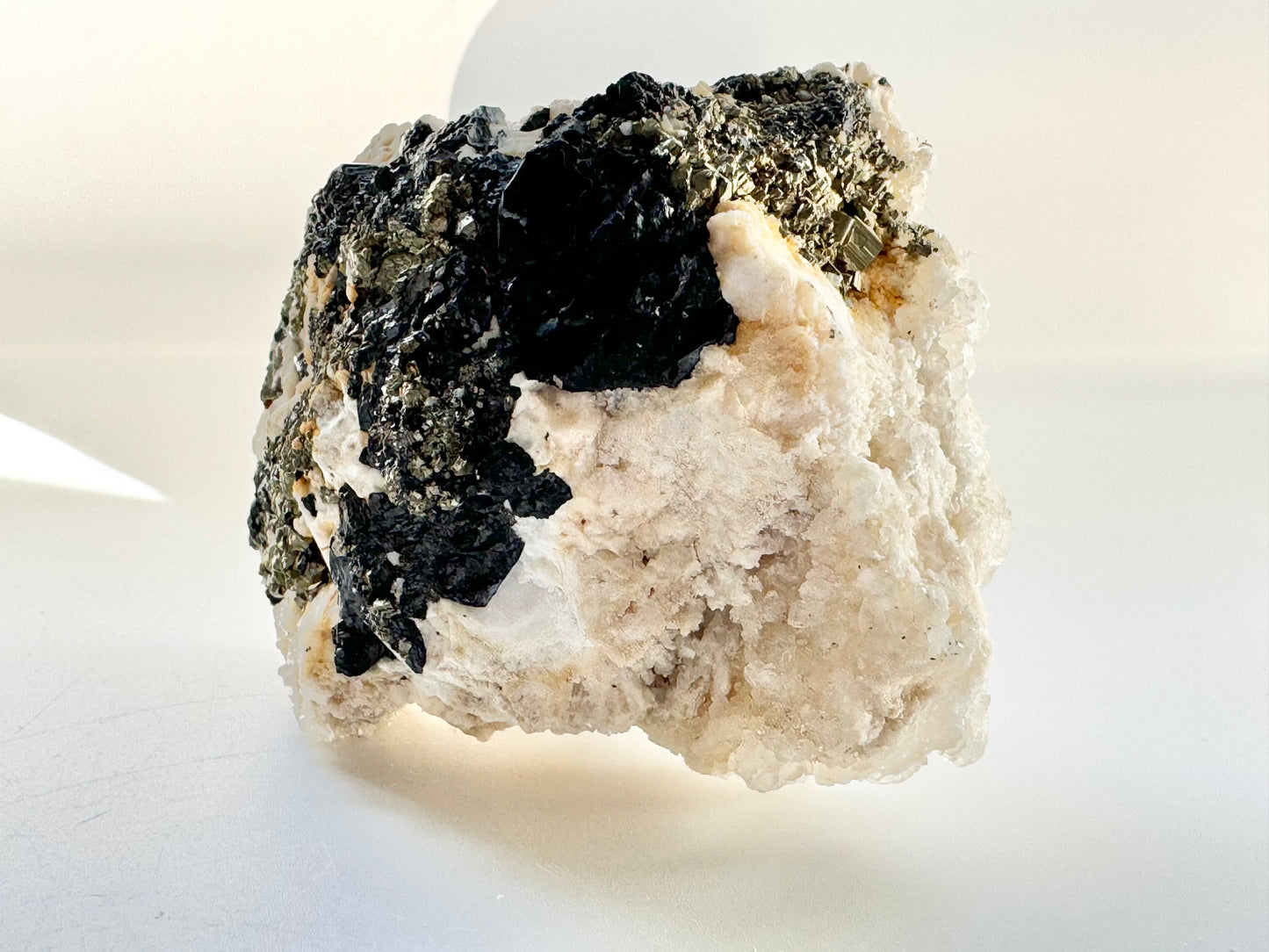 Calcite with pyrite, quartz, and galena (or tetrahedrite)