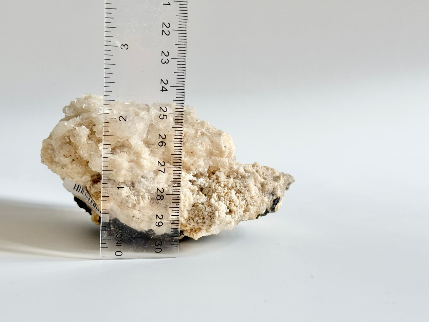 Calcite with pyrite, quartz, and galena (or tetrahedrite)