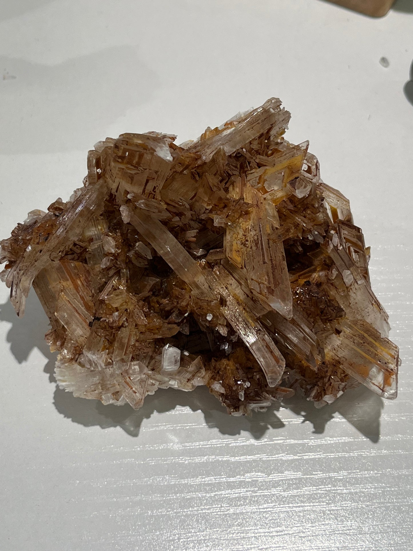 Selenite Cluster with orange/brown staining