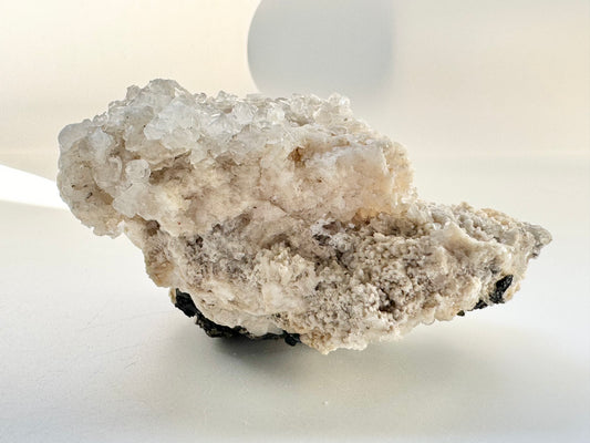 Calcite with pyrite, quartz, and galena (or tetrahedrite)