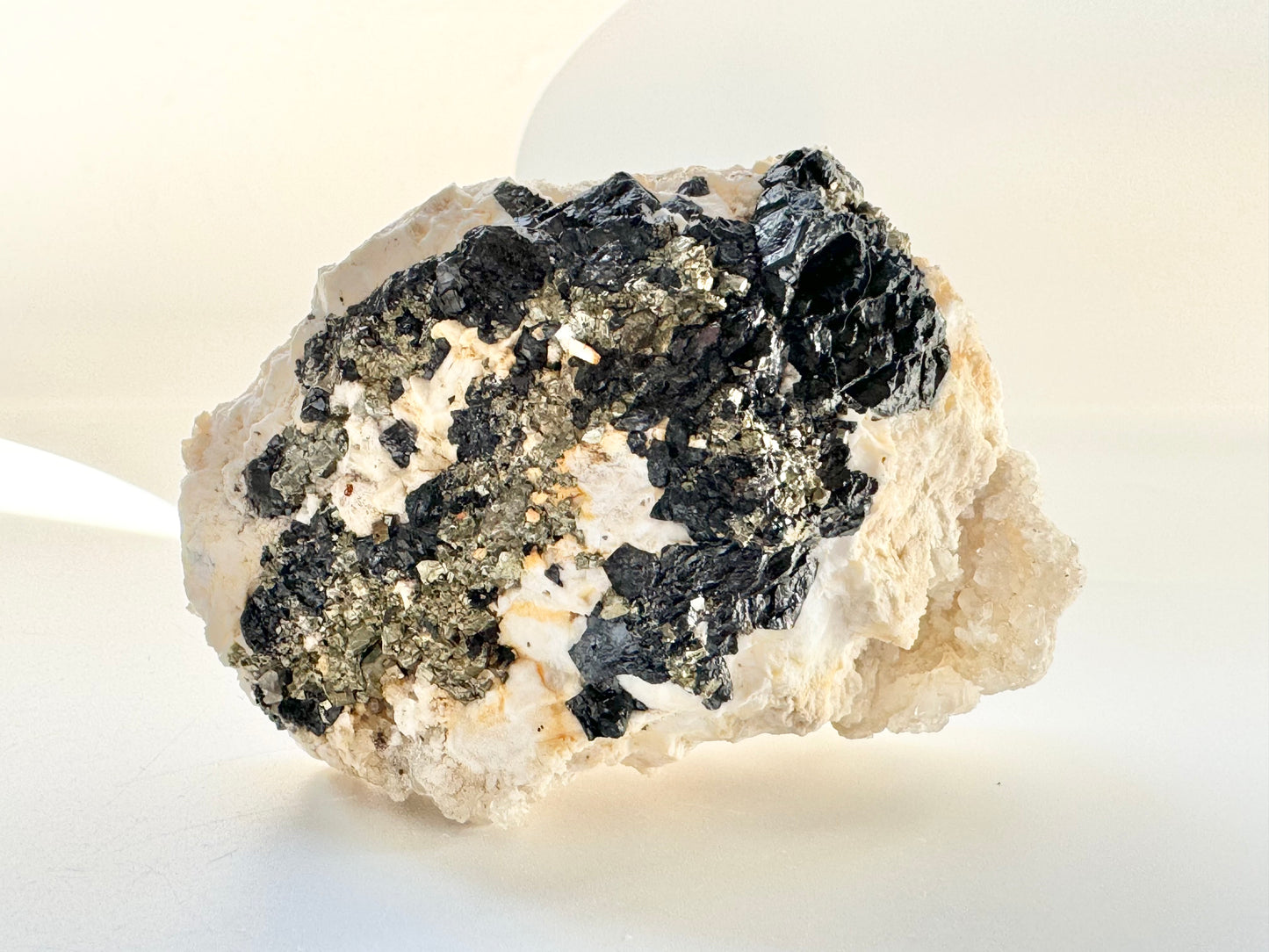 Calcite with pyrite, quartz, and galena (or tetrahedrite)