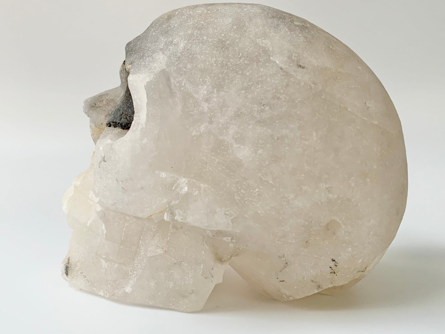 Quartz side Cluster Skull, iron staining and black eye