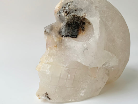 Quartz side Cluster Skull, iron staining and black eye